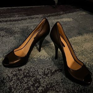 Back leather open toes high heel.